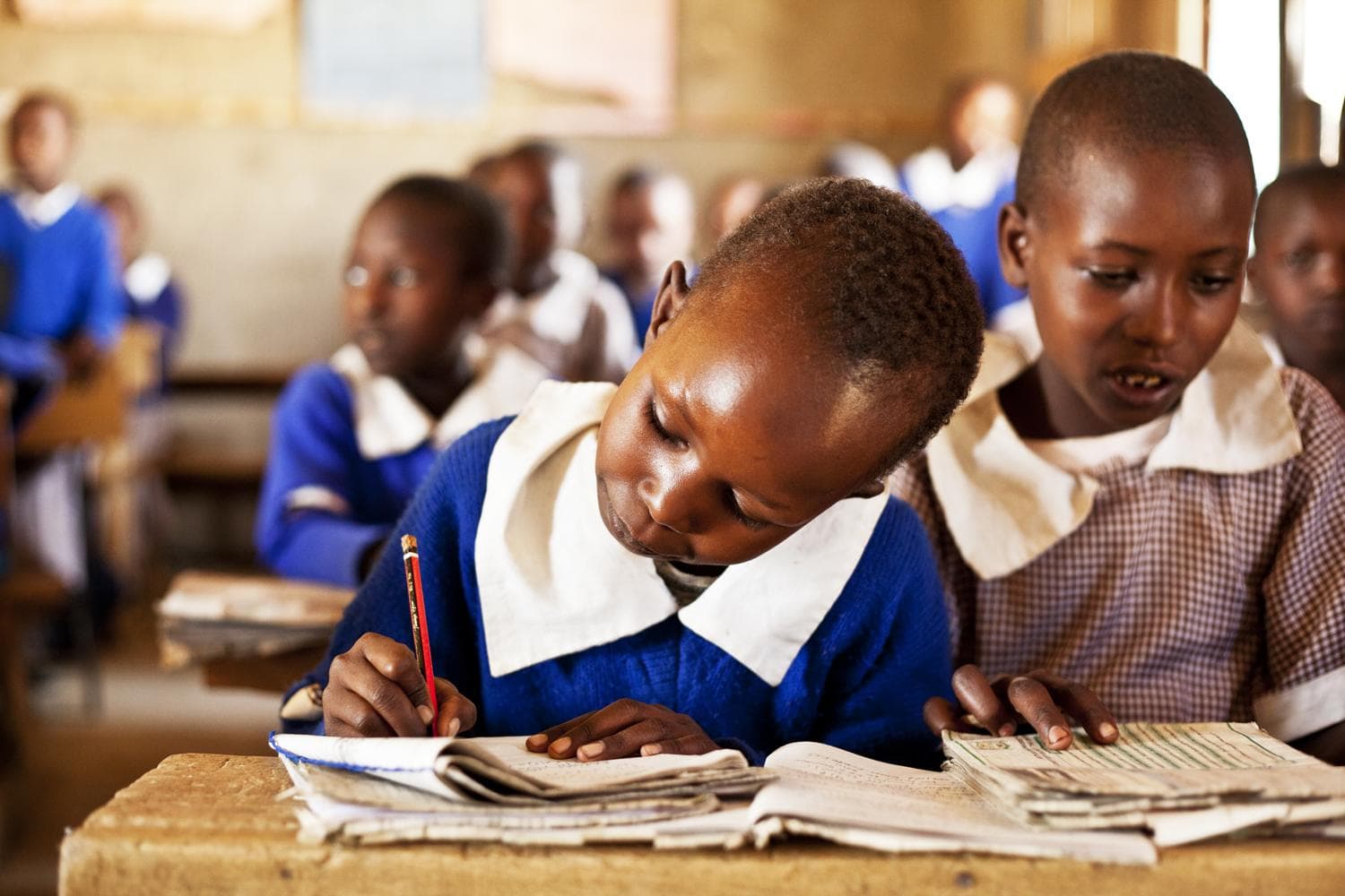 A Maasai girl learning in a supportive school environment